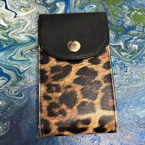 K. Carroll Cheetah print travel satchel.